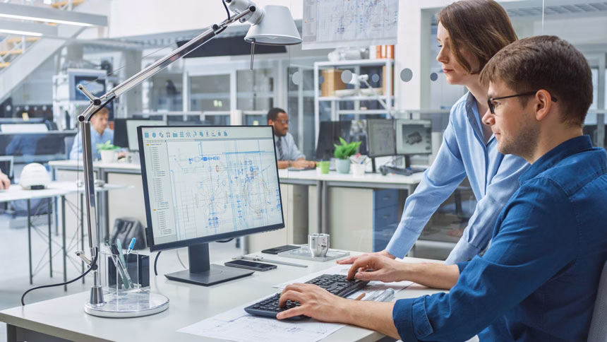 Engineers in front of CAD screen