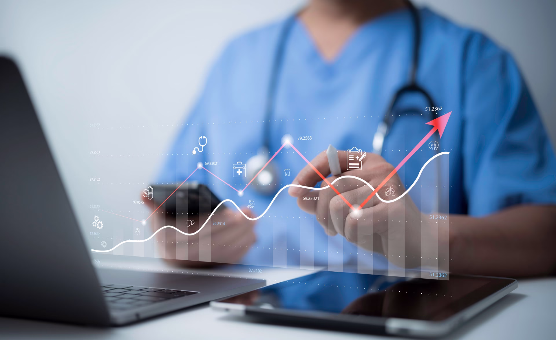 Doctor using a computer and a pad