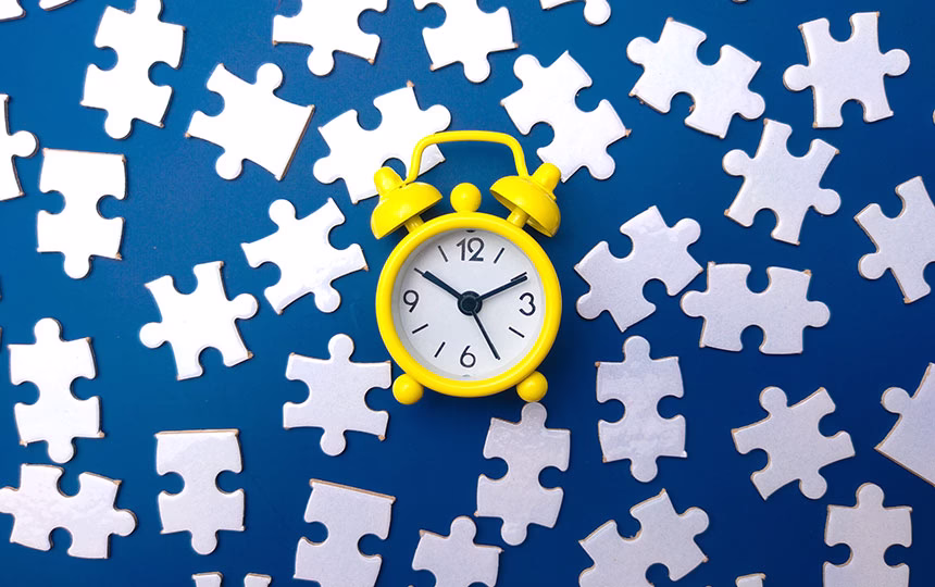 Clock and puzzle pieces