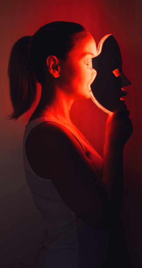 Woman with red-light mask